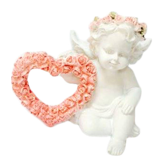 Plaster statue of Guardian Angel with heart